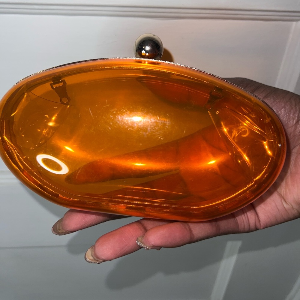 Transparent Orange Oval Clutch
